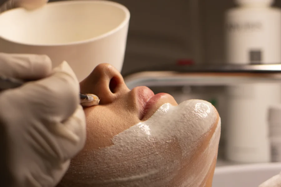 Therapist giving a client a professional deep-cleansing facial